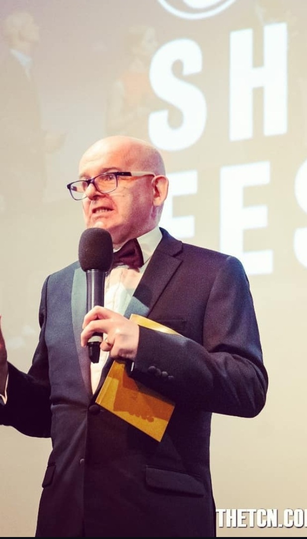 John Byrne speaking at a festival and lecture event